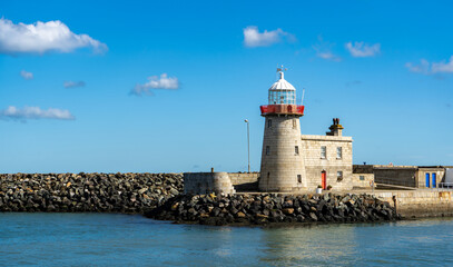 Fototapeta premium Beautiful seascape - Howth lighthouse with boat
