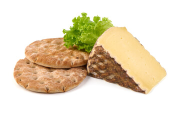 Pieces of cheese tomme de montagne or tomme de savoie cheese, isolated on white background.
