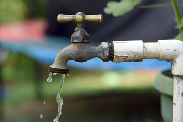 Key with drops of water, water rationing, proper use of water, concept of scarcity of the precious liquid, drought, conservation of the planet,cop 16