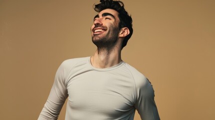 Obraz premium Handsome man standing and smiling on beige background 