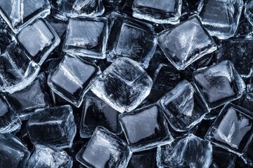 Ice cubes on a dark background, ideal for cooling beverages.