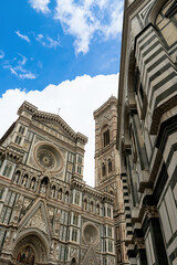 Fototapeta premium Florence Cathedral facade - Duomo di Firenze. Beautiful religious building with cloudy sky