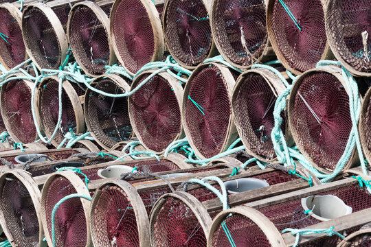 Stacked fish and shellfish pots with ropes
