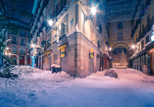 Snow-covered streets of Madrid at night