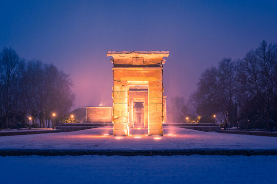 Snow-covered Debod Temple in Madrid at night