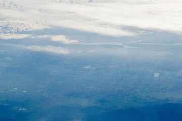 White passenger airplane flying in the sky amazing clouds in the background - Travel by air transport. High quality photo