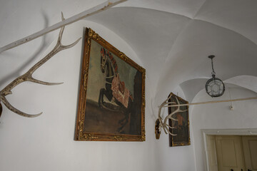 Old painting of a horse in a picture.
