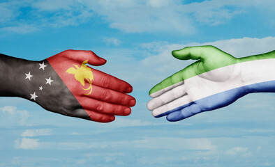 Sierra Leone or Salone and Papua New Guinea country handshaking with flags, consensus concept international co-operation illustration
