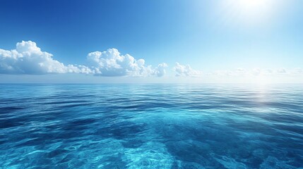 A serene ocean view under a clear sky, showcasing calm waters and fluffy clouds on a bright sunny day.