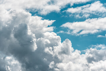 Puffy white clouds with blue sky