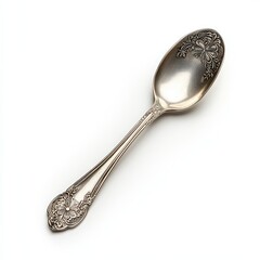 An elegant vintage silver spoon with intricate floral designs, perfect for enhancing table settings or as a decorative piece.