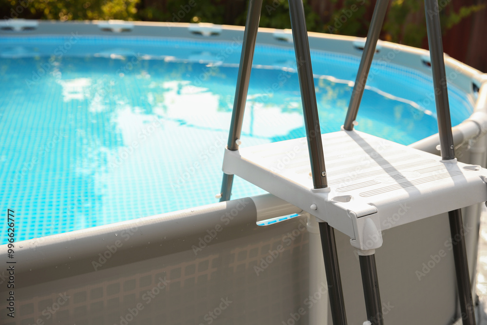 Wall mural above ground swimming pool outdoors on sunny day, closeup