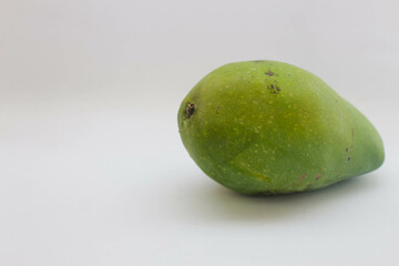 Green mango fruit on white background