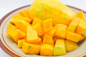 Peeled mango on a white background