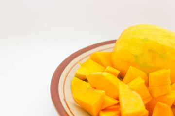 Peeled mango on a white background