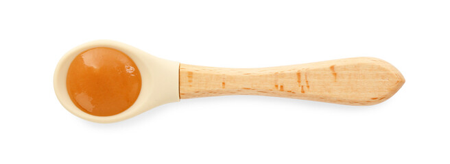 Spoon with tasty baby food isolated on white, top view