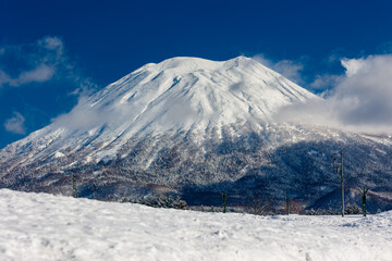 Snow-capped volcano Mount Yotei on a crisp, clear winters day (Niseko, Hokkaido)