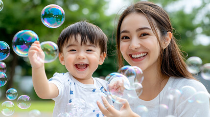 mother and child playing with bubbles in the garden