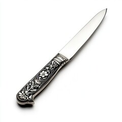 Elegant silver knife showcasing detailed floral engravings on its handle, perfect for dining or decorative purposes.