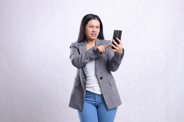 Fototapeta premium beautiful adult office woman hate to mobile phone while touching, holding cellphone wearing grey suit isolated on white background. for technology, lifestyle, shopping, transaction content