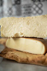 Georgian cheese, Imeretian and smoked suluguni, on a Georgian bread, Georgian cuisine, no people,. High quality photo