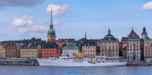 Waterfront panorama, the old town Gamla Stan, the royal ship Norge with Norwegian royals visiting...