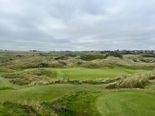 Fototapeta premium golf course. nature, golf, golf course, nature, grass, sky, field, landscape, green, meadow, summer, cloud, clouds, tree, blue, countryside, course, hill, view, spring, country, trees, mountain, lawn,