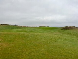 Fototapeta premium golf course. nature, golf, golf course, nature, grass, sky, field, landscape, green, meadow, summer, cloud, clouds, tree, blue, countryside, course, hill, view, spring, country, trees, mountain, lawn,