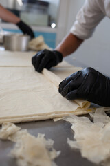 Preparing traditional greek filo pastry with cheese stuffing