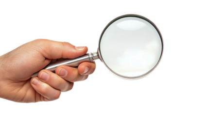A close-up image of a hand holding a magnifying glass with a white background.