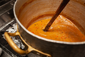 Close up for pot with red sauce or soup