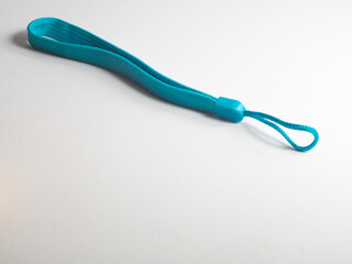 Light blue wrist strap on a white background, suitable for attaching to smartphones, small cameras, drinking bottles, keys, and so on