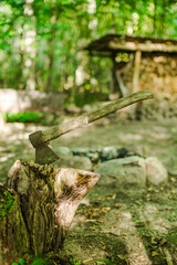 vintage ancient axe wood cutting in old wood lumber in forest