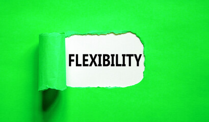 Flexibility symbol. Concept word Flexibility on beautiful white paper. Beautiful green paper background. Business flexibility concept. Copy space.