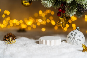 Christmas Holiday background with snow, fir tree and decorations with christmas light behind....