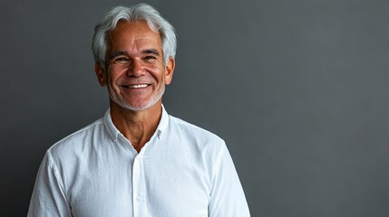 Obraz premium Mature Man With Gray Hair Wearing Casual White Shirt Smiling Confidently Against Gray Wall
