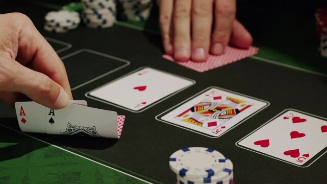 Game of poker in casino, taking place with poker chips and cards on a green table, gambling place, roulette jack pot. 