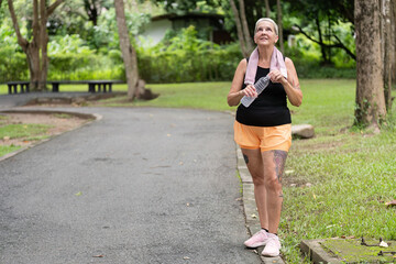 Mature Woman Promoting Health and Fitness with a Meditative Walk in Nature