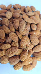 Almond in shell closeup white Background of almonds Healthy food