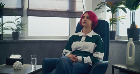Teen girl with pink hair shares her feelings, discusses problems, finds solution during counseling...