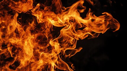 Fototapeta premium A close-up view of vibrant, dancing flames against a dark background, showcasing the dynamic beauty and intensity of fire.