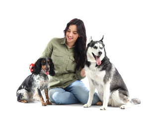 Young woman with cute dogs sitting on white background