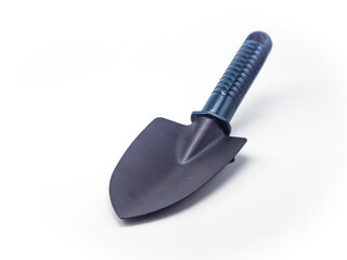 Small earthen shovel isolated on a white background, this shovel is suitable for gardening