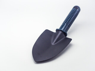 Small earthen shovel isolated on a white background, this shovel is suitable for gardening