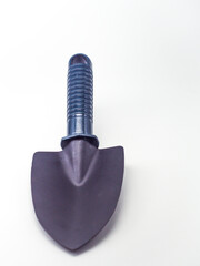 Small earthen shovel isolated on a white background, this shovel is suitable for gardening