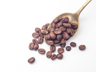 Fototapeta premium Roasted coffee beans with ancient copper spoon on white background