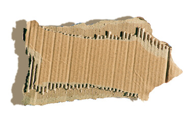 A piece of textured packaging cardboard. Brown wrapping vintage paper, isolated top view. Piece of torn cardboard with copy space.