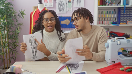 In a tailor shop, a man and woman designer team excitedly discuss fashion sketches, surrounded by sewing materials and a mannequin.