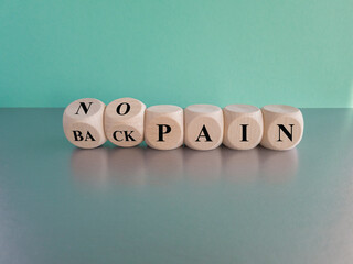 Turned cubes and changes the expression 'back pain' to 'no pain'. Beautiful blue background. Medical concept.