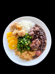 plate of food with rice, beans, salad and meat, healthy food, feijoada, pork rind, pancetta